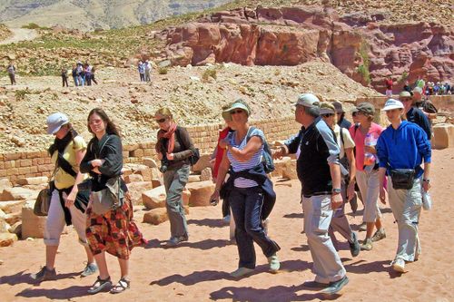 Tour guide leading his group to the Petra site in Jordan